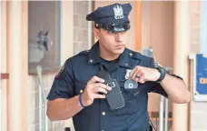  ?? JONAH MARKOWITZ FOR USA TODAY ?? Officer Ameer Alateek of the Jersey City Police shows how a cellphone app can be used in place of a body camera.