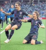  ?? REUTERS ?? Croatia's Luka Modric (right) celebrates after scoring their second goal against Argentina on Thursday.