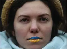  ?? NANCY LANE — BOSTON HERALD ?? Olga Gavin wears blue and yellow on her lips, the colors of Ukraine, during a rally in Copley Square on Sunday.