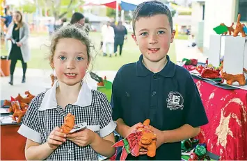  ?? ?? Siblings prep student Indie and grade two student Jack Jameson show off their ceramic creations.