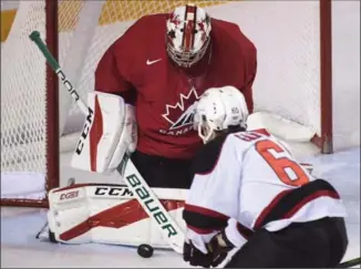  ?? CANADIAN PRESS FILE PHOTO ?? Canada goalie Carter Hart is the choice to start for Canada in the world junior hockey tournament. Above, he makes a save against an all-star team of Canadian university players in an exhibition game Dec. 14.