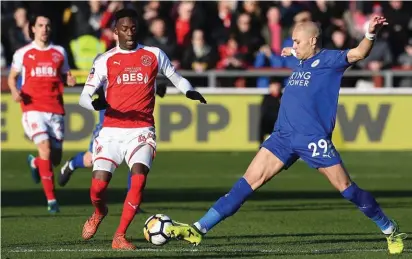  ??  ?? Highly-rated striker Devante Cole is dispossess­ed by a sliding challenge from Leicester defender Yohan Benalouane.