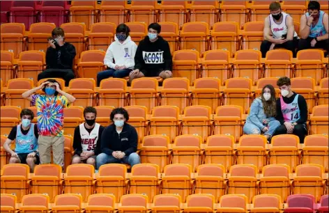  ?? AP Photo/Marta Lavandier ?? Fans watch during the second half of an NBA basketball game between the Miami Heat and the Los Angeles Clippers, on Jan. 28 in Miami.