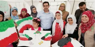  ??  ?? Al-Sayer Group’s CEO Hamed Al-Sayer poses with children.