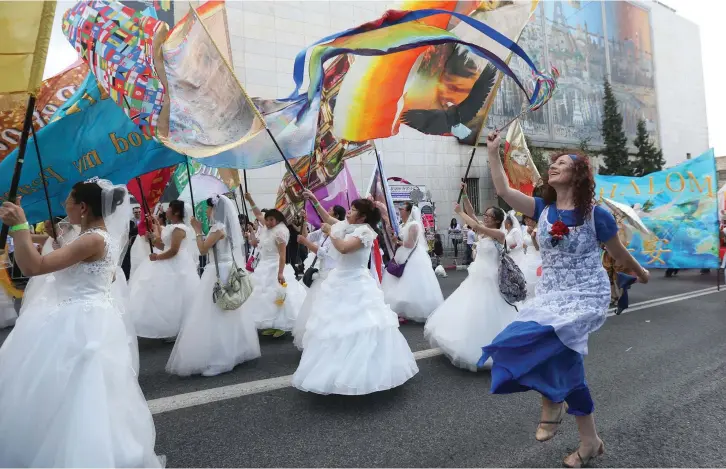  ??  ?? CELEBRANTS AT the annual Jerusalem Day parade.