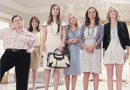  ?? SUZANNE HANOVER UNIVERSAL PICTURES ?? “Bridesmaid­s” proved that a raunchy female-led comedy could carry the box office. Melissa McCarthy, left, Ellie Kemper, Rose Byrne, Wendi McLendon-Covey, Maya Rudolph and Kristen Wiig are shown in a scene from the movie.