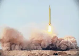  ?? IRANIAN REVOLUTION­ARY GUARD/SEPAHNEWS ?? A missile is launched in a drill Saturday in Iran. The Iranian Guard launched ballistic missiles at a simulated target in the Indian Ocean.