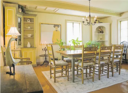  ?? PHOTOS: PERRY MASTROVITO ?? The dining room is bright and airy. The tall dresser in the corner was a red-painted bookcase and the dining set was customized by a local cabinet maker.