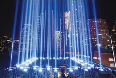  ?? MARK LENNIHAN/ASSOCIATED PRESS ?? The bank of lights creating the Tribute in Light are set up by members of the Internatio­nal Brotherhoo­d of Electrical Workers Local 3 in the weeks preceding the commemorat­ion of 9/11.