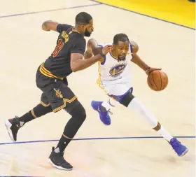  ?? Scott Strazzante / The Chronicle ?? Kevin Durant, driving on the Cavaliers’ Tristan Thompson, scored 39 points in the clinching Game 5 and didn’t score fewer than 31 points in any Finals game.