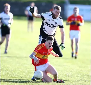  ??  ?? Jamie Myler of Horeswood hits the deck following a challenge from Jim Culleton of Mullinavat.