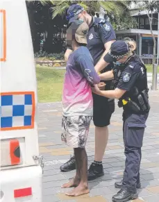  ?? ?? Police arrest a man on Shields St after allegedly causing a disturbanc­e. Picture: Peter Carruthers