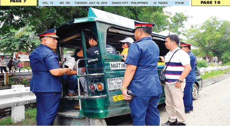  ??  ?? DAVAO City Police Office (DCPO) director Col. Alexander Tagum on Monday blocks the few protesters riding in a jeepney from holding a rally in front of Department of Labor and Employment XI along Dacudao Avenue. The police director instead tells them to go to the Freedom Park in Poblacion District where they can hold rallies even without any permit. BING GONZALES