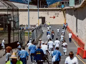  ?? Gabrielle Lurie/The Chronicle ?? Inmates exercise outside San Quentin State Prison. The state is spending millions to keep prisons from falling into disrepair.