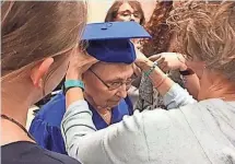  ?? BOYD HUPPERT, KARE-TV ?? The great-grandchild­ren of Esther Begam help her with her graduation cap. Begam received an honorary diploma.