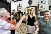  ??  ?? Countess Alwine Federico toasts tour-group members in her home, Palazzo Conte Federico — one of the oldest dwellings in Palermo, Sicily.