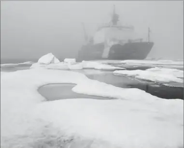  ?? Bonnie Jo Mount/The Washington Post ?? Ice floes and fog surround the U.S. Coast Guard Cutter Healy in the Arctic Ocean on July 29, 2017. The cutter is the largest icebreaker in the Coast Guard and serves as a platform for scientific research.