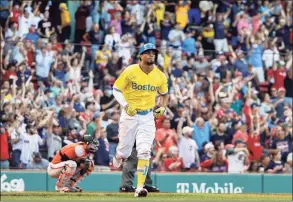  ?? Winslow Townson / Getty Images ?? The Red Sox’s Xander Bogaerts starts toward the bases after his three-run home run against the Baltimore Orioles during the sixth inning at Fenway Park on Saturday.