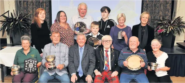  ??  ?? Green for go John Summers, chairman of Beautiful Perth (seated centre left) and Provost Dennis Melloy (seated centre right) with award winners