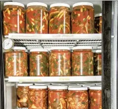 ?? Mariah Tauger Los Angeles Times ?? KIMCHI OFFERINGS in a Los Angeles store in 2020. The author’s wife recently purchased a kimchi refrigerat­or without telling him.