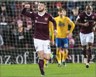  ??  ?? Hearts defender Craig Halkett celebrates his goal against Kilmarnock on Wednesday evening