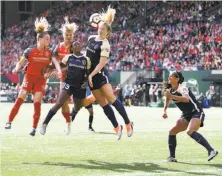  ?? Adam Lapierre / Associated Press ?? Portland’s Crystal Dunn (19) heads the ball in a 3-0 loss to National Women’s Soccer League champion North Carolina.