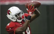  ?? AP PHOTO/ROSS D. FRANKLIN ?? Arizona Cardinals wide receiver J.J. Nelson makes a catch during an NFL football training camp on Thursday, in Glendale, Ariz.