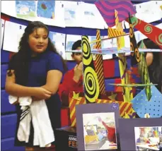  ?? PHOTO COURTESY EL CENTRO ELEMENTARY SCHOOL DISTRICT ?? El Centro Elementary School District students walk by their fellow students’ art projects for the district’s Annual Arts Festival, held on April 5, 2023, in El Centro.