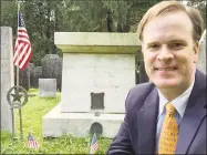  ?? John Torsiello / For Hearst Connecticu­t Media ?? Spy Symposium coordinato­r Damien Cregeau poses in front of Revolution­ary War hero Benjamin Tallmadge's gravesite in Litchfield.