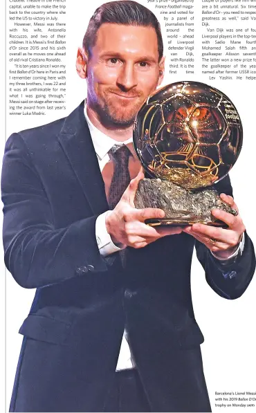  ?? (AFP) ?? Barcelona’s Lionel Messi with his 2019 Ballon D’Or trophy on Monday