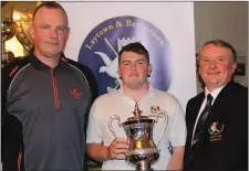  ?? Picture: Joe Ryan ?? Caolan Rafferty (Dundalk and Maynooth University) is presented with the Laytown & Bettystown GC Senior Scratch Cup by L&B PGA Profession­al and competitio­n sponsor Scott Kirkpatric­k (left) and club captain Bryan Collins.