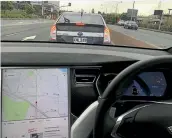  ??  ?? This is what a Prius PHV looks like from inside a Tesla. Zero100kmh in under three seconds not helping now, is it?