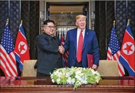  ?? MINISTRY OF COMMUNICAT­IONS SINGAPORE ?? In a “warm, very positive letter” to President Donald Trump (right), North Korean leader Kim Jong Un (left) requested a follow-up meeting to the historic Singapore summit held in June.
