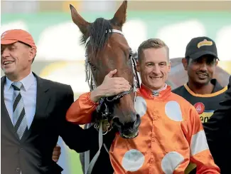  ?? PHOTO: GETTY IMAGES ?? Jockey Blake Shinn hugs Who Shot Thebarman after his Sydney Cup success at Randwick on Saturday.