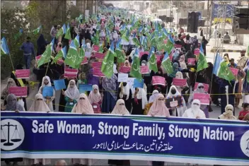  ?? K.M. CHAUDARY — THE ASSOCIATED PRESS ?? Women supporters of a religious party “Jamaat-e-islami” participat­e in a rally to mark Internatio­nal Women’s Day, in Lahore, Pakistan, on Wednesday. The day officially recognized by the United Nations in 1977, is celebrated around the world on Wednesday.