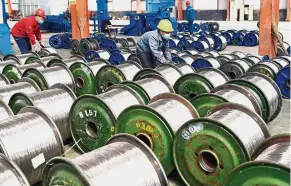  ?? — AFP ?? Big gains: While Chinese aluminium companies now face the same tariff obstacle as other exporters to the United States, they appear better placed to benefit from some of the most likely unintended consequenc­es of the Trump administra­tion’s policies.