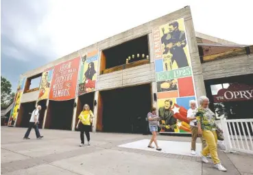  ?? ASSOCIATED PRESS FILE PHOTO ?? People visit the Grand Ole Opry House in May 2013 in Nashville. The iconic facility will undergo a $12 million expansion to add parking, larger retail space and an enhanced area for backstage tours.