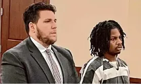  ?? Robert Gavin / Times Union ?? Brian Moses, 21, stands beside his attorney, Derrick Hogan, as he is sentenced to 50 years to life in state prison for murder.