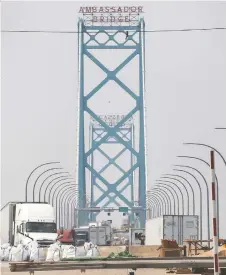  ?? DAN JANISSE ?? Traffic on the Ambassador Bridge on Monday. Travel may pick up as the border has reopened for most Americans.