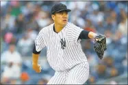  ?? Jim McIsaac / Getty Images ?? Masahiro Tanaka pitches in the second inning against the Angels on Sunday at Yankee Stadium.