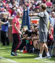  ?? TONY DING — THE ASSOCIATED PRESS ?? Manchester United manager Jose Mourinho, left, has an exchange on the touchline with Liverpool manager Jurgen Klopp, right.