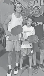  ?? MARY BARSALEAU/SPECIAL TO THE DESERT SUN ?? Eduardo Gonzalez Jr. (left), brother Santiago Gonzalez and father Eduardo Gonzalez Sr. all play pickleball in the Coachella Valley.