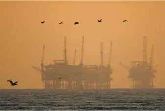  ?? David McNew / Getty Images 2009 ?? California officials are seeking funds to dismantle two drilling rigs like these near Santa Barbara in the wake of bankruptci­es. The federal government wants to expand offshore drilling.