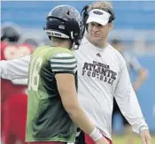  ?? MICHAEL LAUGHLIN/STAFF PHOTOGRAPH­ER ?? FAU coach Lane Kiffin instructs quarterbac­k Rafe Peavey, who transferre­d from SMU in early August.