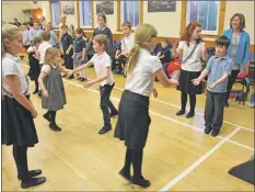  ?? 01_B49dance05 ?? Pupils learn some of the routines by watching their friends.