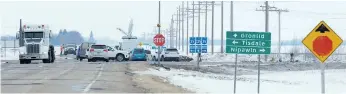  ?? JONATHAN HAYWARD/THE CANADIAN PRESS ?? The scene of Friday’s bus crash at the intersecti­on of Highway 335 and Highway 35 near Tisdale on Monday. The intersecti­on has been the scene of other fatal accidents.