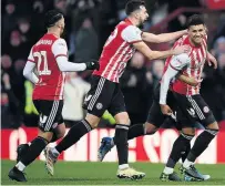  ??  ?? BUZZING Ollie Watkins with team-mates after his second goal