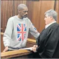  ?? Picture: KATHRYN KIMBERLEY ?? RUTHLESS KILLER: Convicted murderer Peter Pietersen speaks to defence advocate Jodene Coertzen in the Port Elizabeth High Court yesterday
