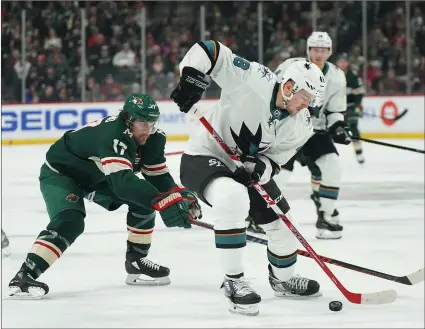  ?? Jeff Wheeler / Minneapoli­s Startribun­e /TNS ?? Minnesota Wild left wing Marcus Foligno (17) pursues San Jose Sharks centertoma­s Hertl (48) and the puck in the first period Monday, March 11, 2019 at the Xcel Energy Center in St. Paul, Minnesota.