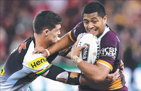  ?? SLIPPERY CUSTOMER: Bronco Anthony Milford attempts to break away from the Penrith defence at Suncorp Stadium last night. ??